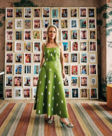 Hunter Bell standing in her office in front of a moodboard.