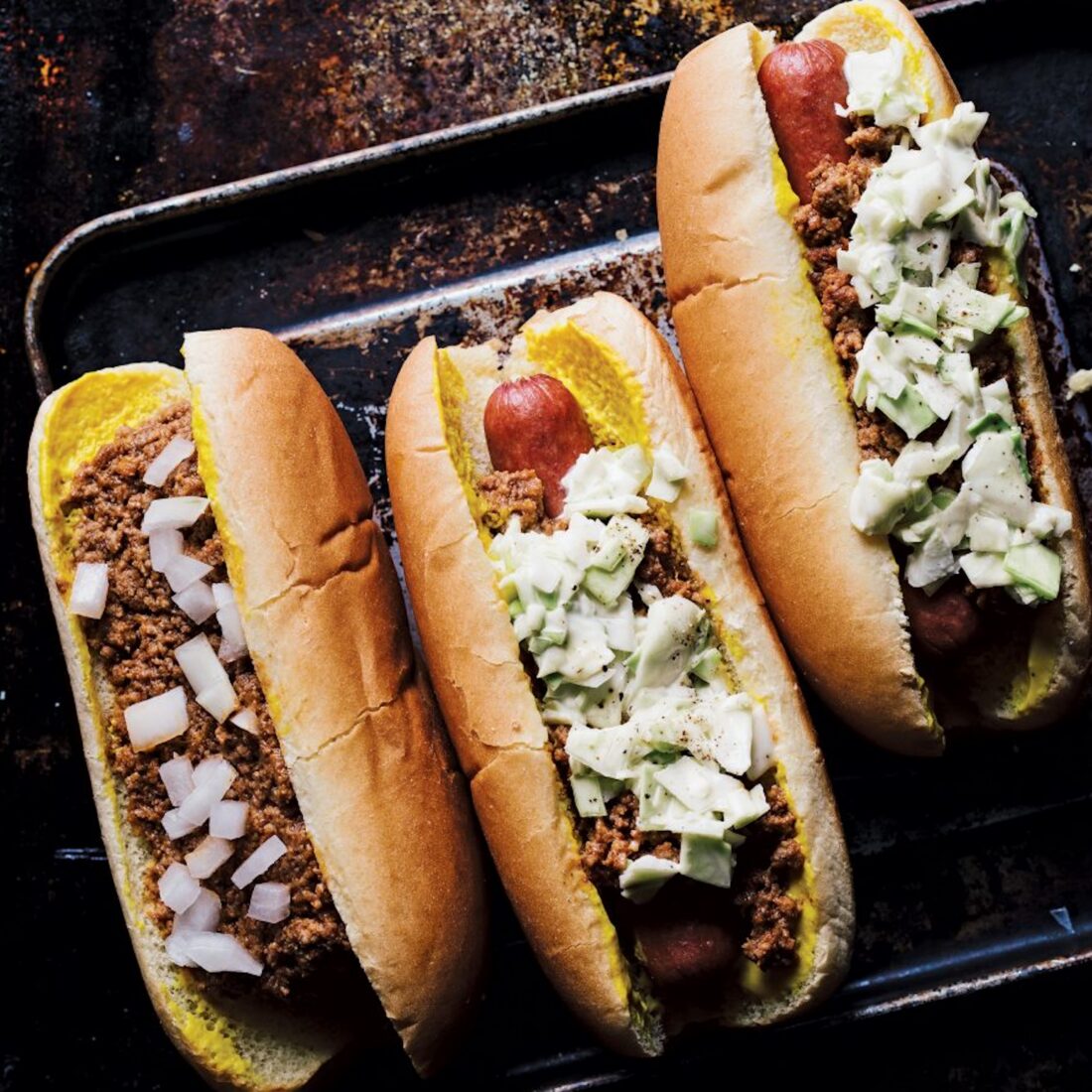 image of hot dogs and chili dogs with topppings