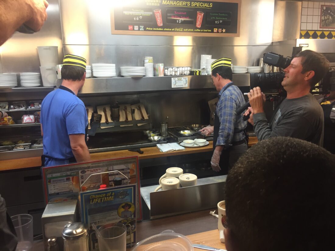 Two men in a waffle house kitchen