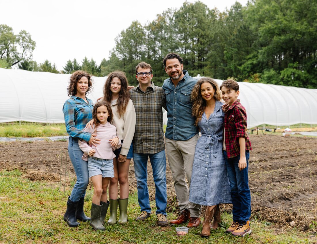 image of both families standing together on the farm
