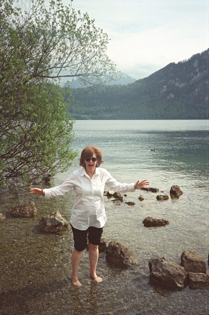 A woman stands in a lake