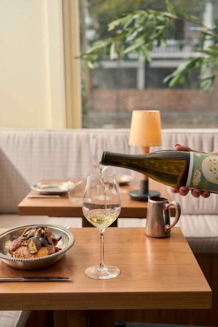 A table with chicken and wine