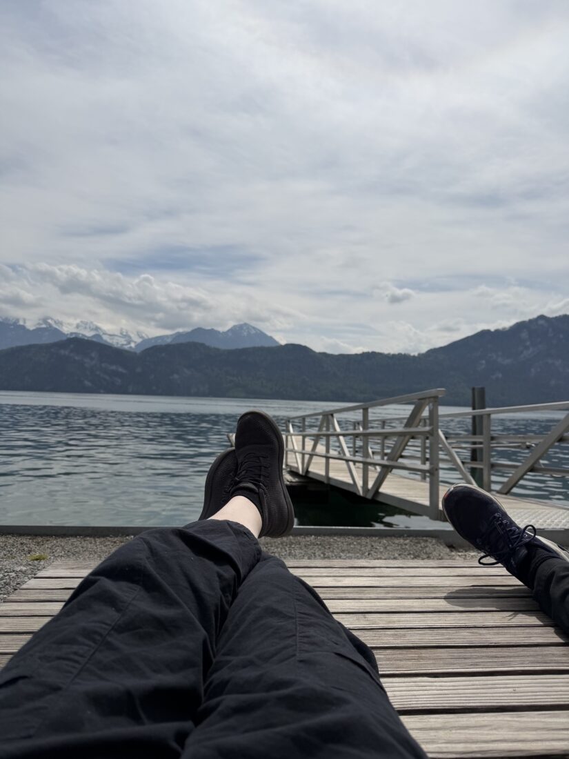 A view of women's shoes in front of a lake