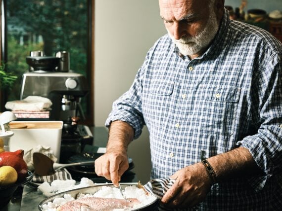 A man with a salt baked fish