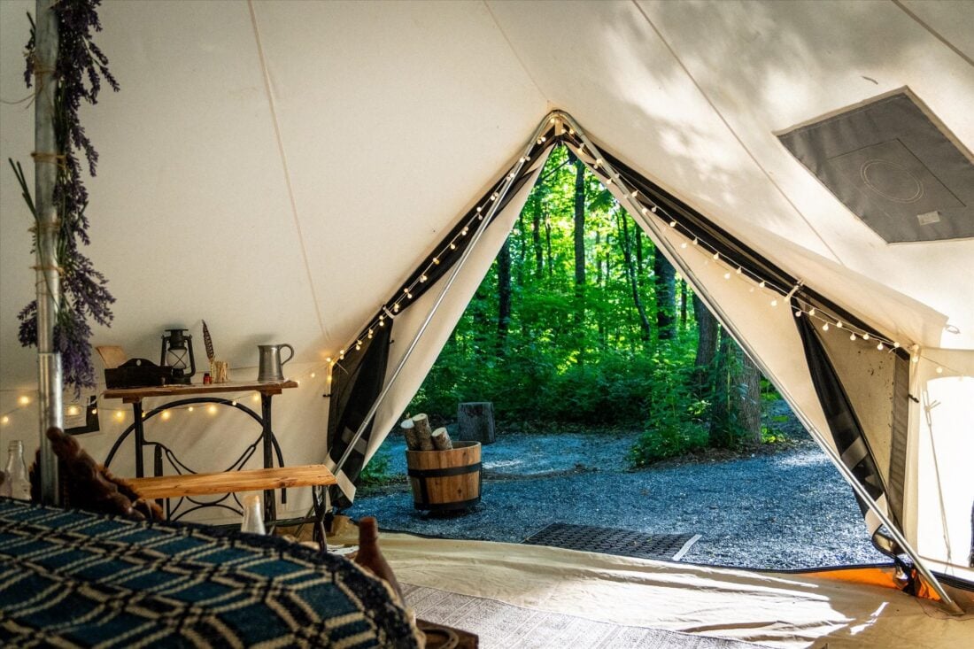 view from inside a tent looking out into the mountains