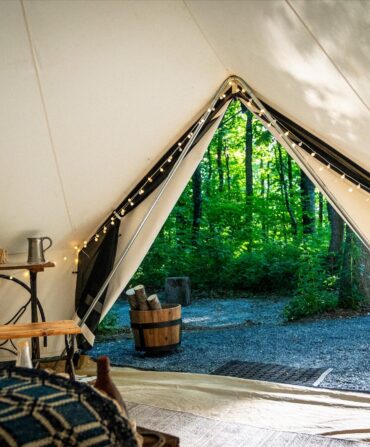 view from inside a tent looking out into the mountains