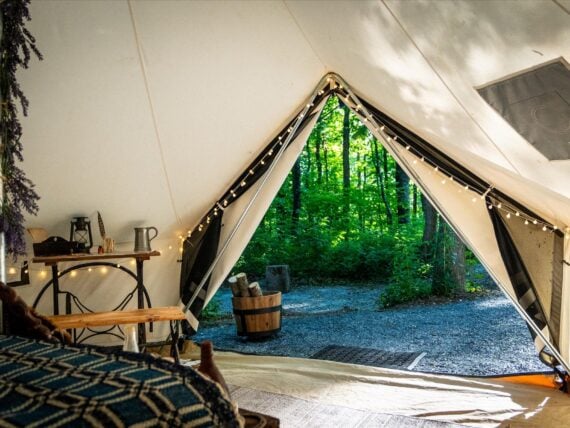 view from inside a tent looking out into the mountains