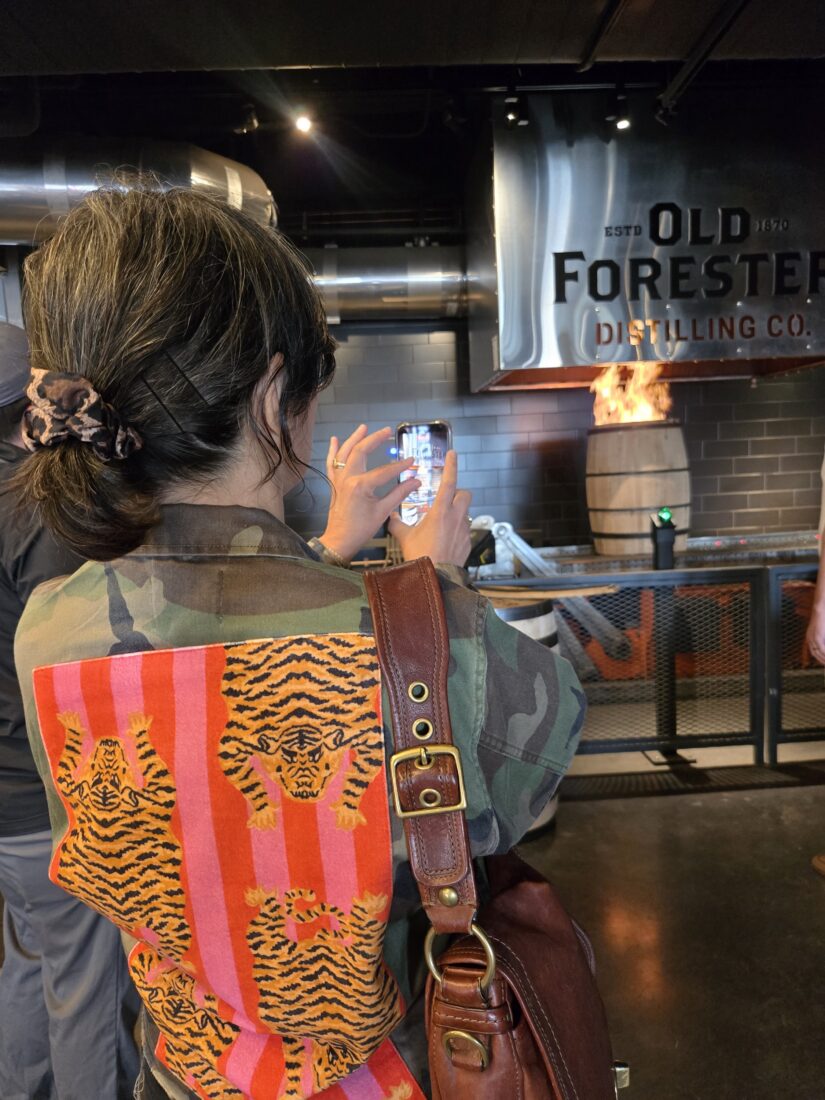 A woman in front of a barrel firing