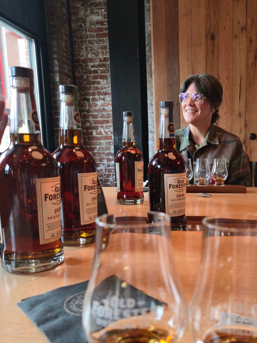 A woman at a bourbon tasting