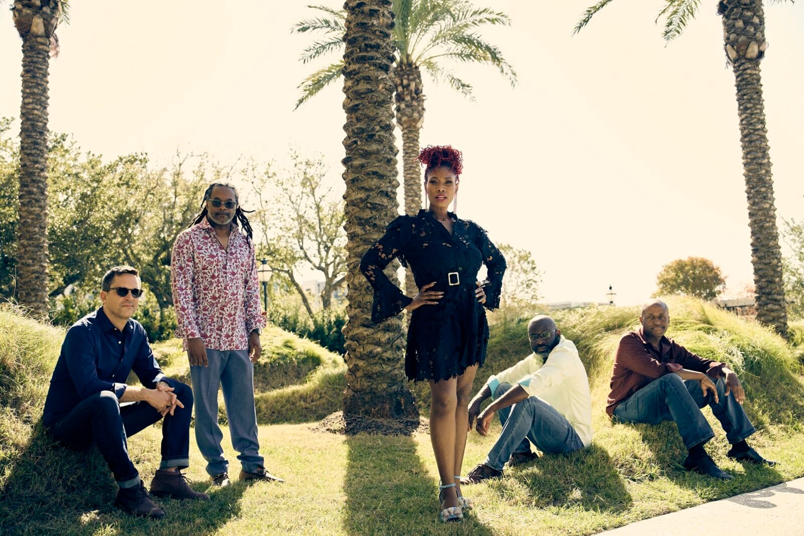 image of the band, Ranky Tanky, posing for a photo in a field