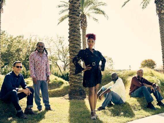 image of the band, Ranky Tanky, posing for a photo in a field
