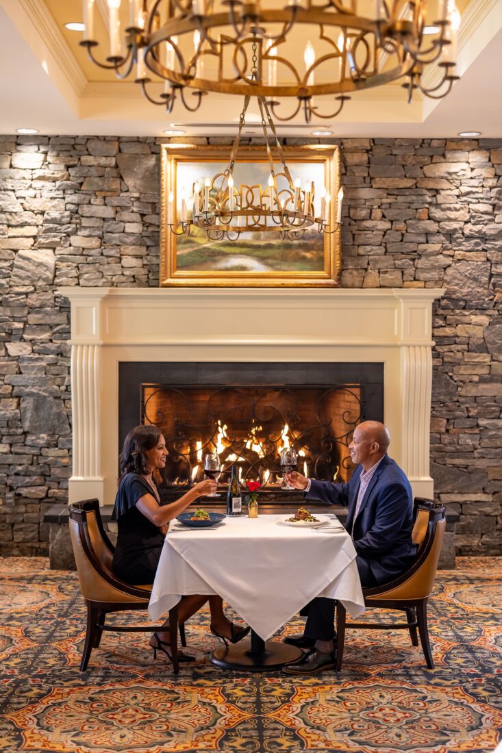 A dining room with two people at a table