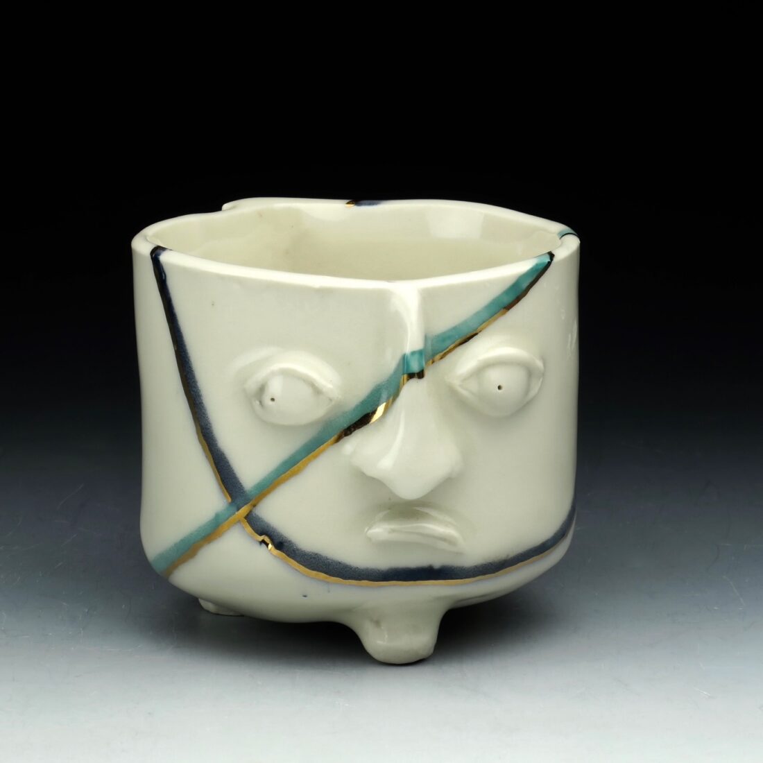 image of a white porcelain jug with a face on it