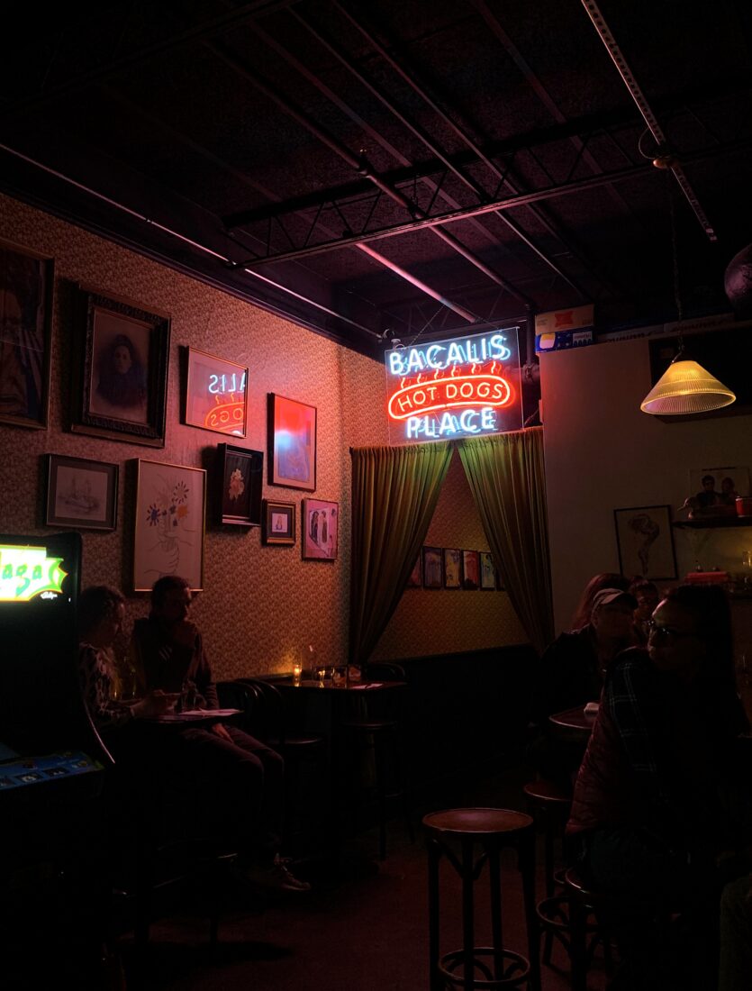A hot dog sign in a bar