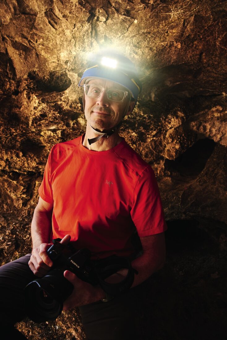 A photographer in a cave