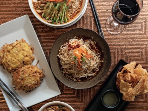 Clockwise from top: Royal China’s chicken noodles in peanut sauce, Dan Dan Mian, wonton chips and dips, and egg foo yong with a shrimp-and-vegetable gravy.