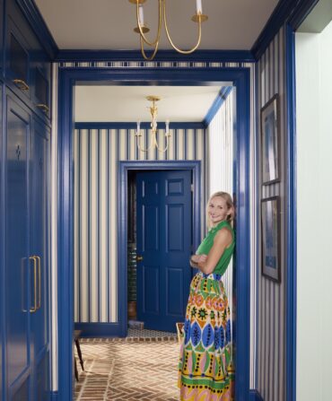 image of designer Alexa Stevenson in a blue doorway