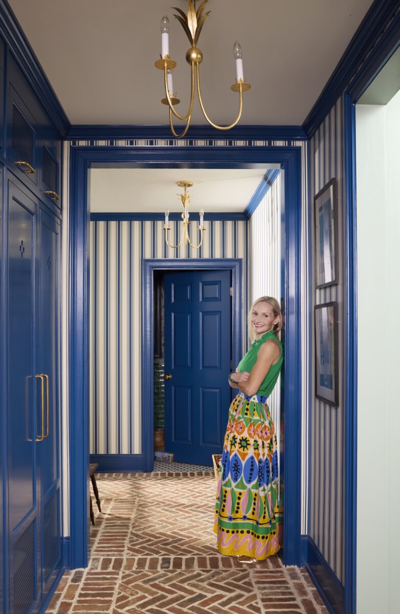 image of designer Alexa Stevenson in a blue doorway
