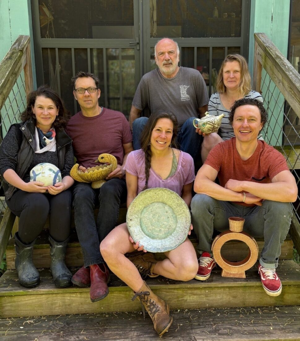 image of six athen's potters sitting on the steps