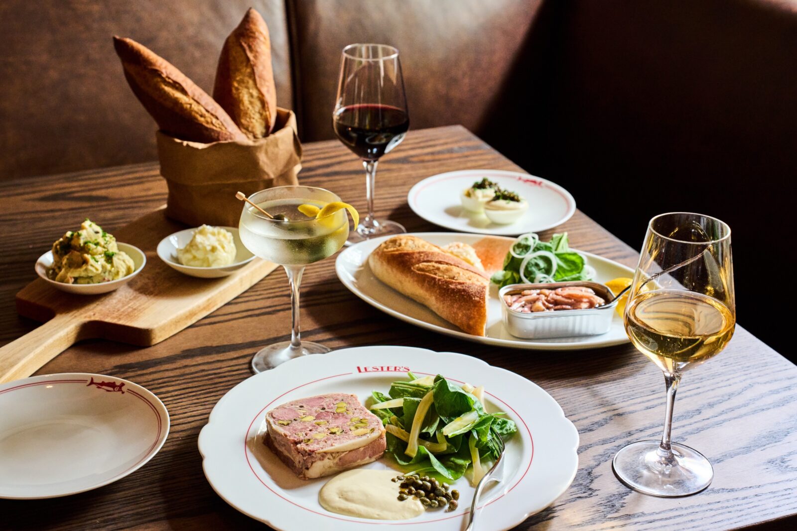 menu items on a table including tinned fish and country duck pâté.
