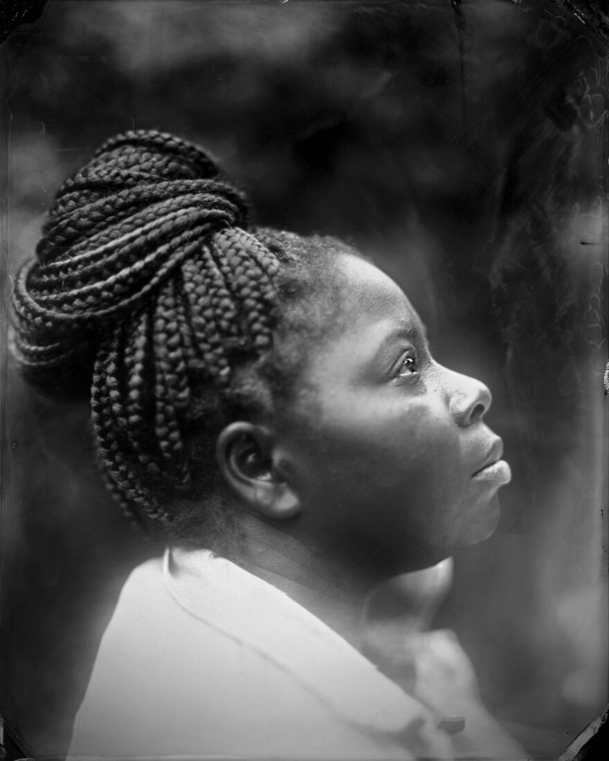 A black and white portrait of a woman