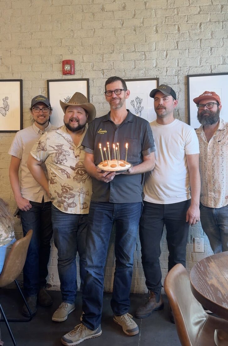 A man holds a banana pudding pie