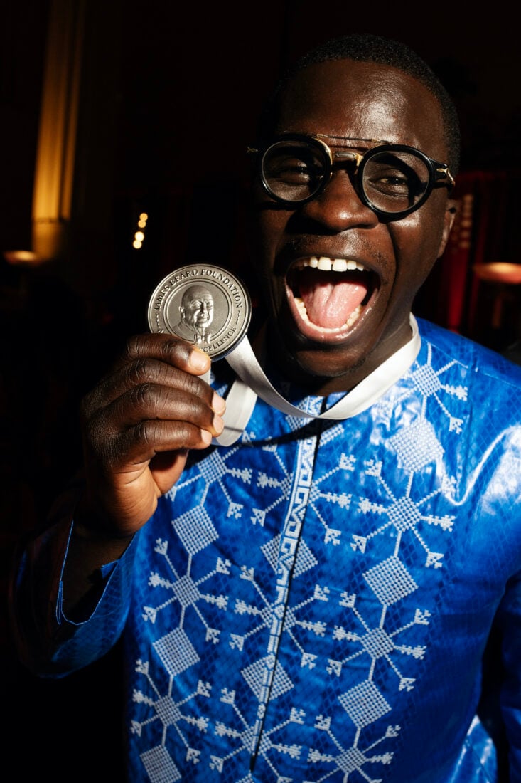 A portrait of a man with an award
