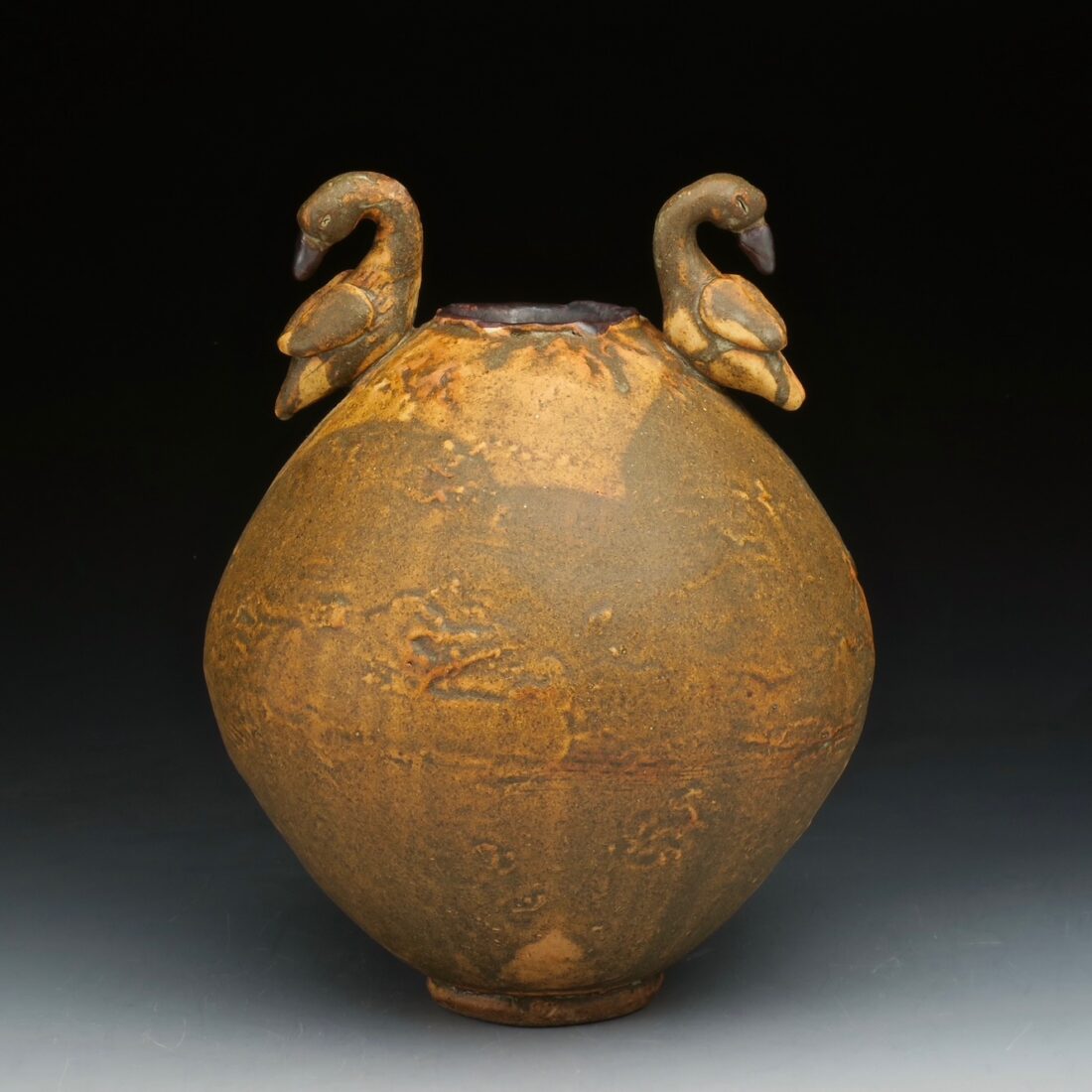 image of a brown vase with animal details