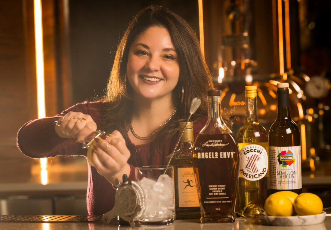 A woman behind a bar