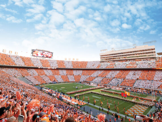 The Tennessee Volunteers run through the ”T“ during a 2024 game at the University of Tennessee’s Neyland Stadium.