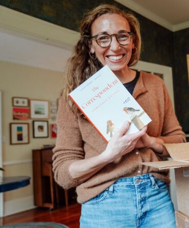 A portrait of a woman holding a book