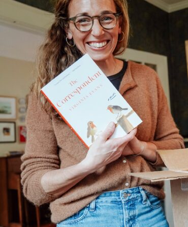A portrait of a woman holding a book