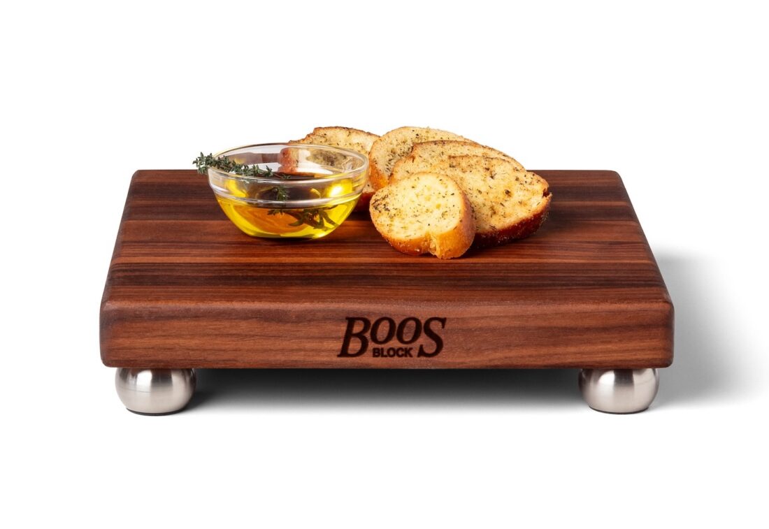 image of a wooden cutting board with bread and oil 