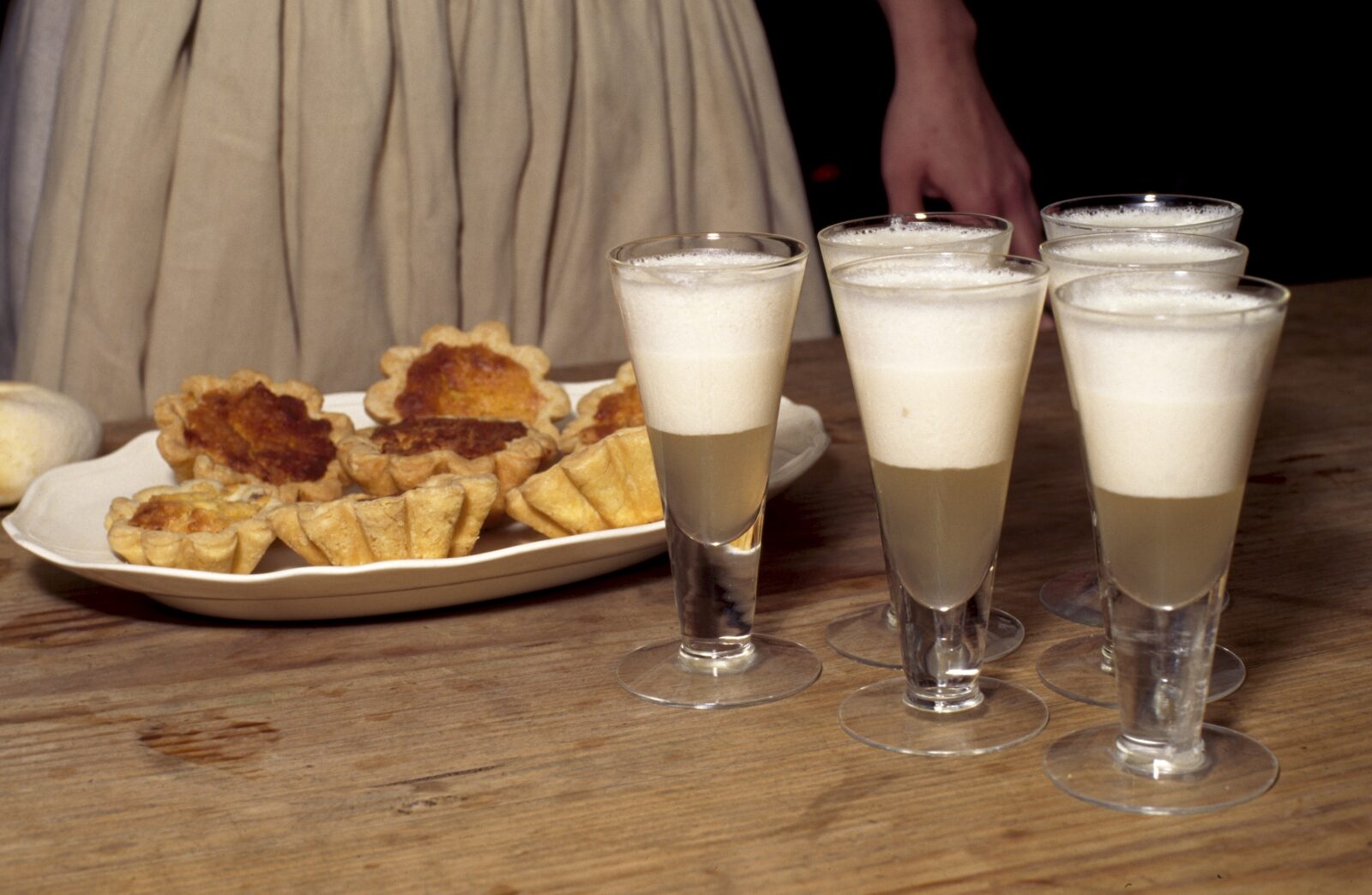 Syllabub and tarts on a table