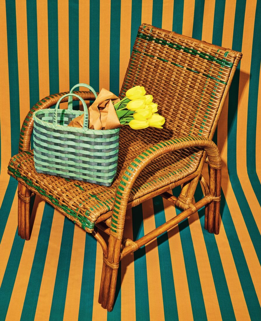 A woven basket and woven chair on a stripe background