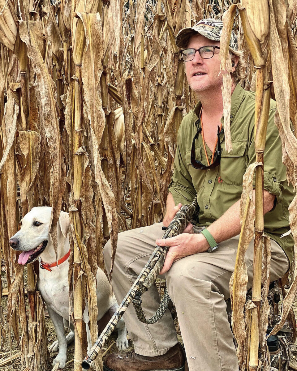 A man with a dog in the field