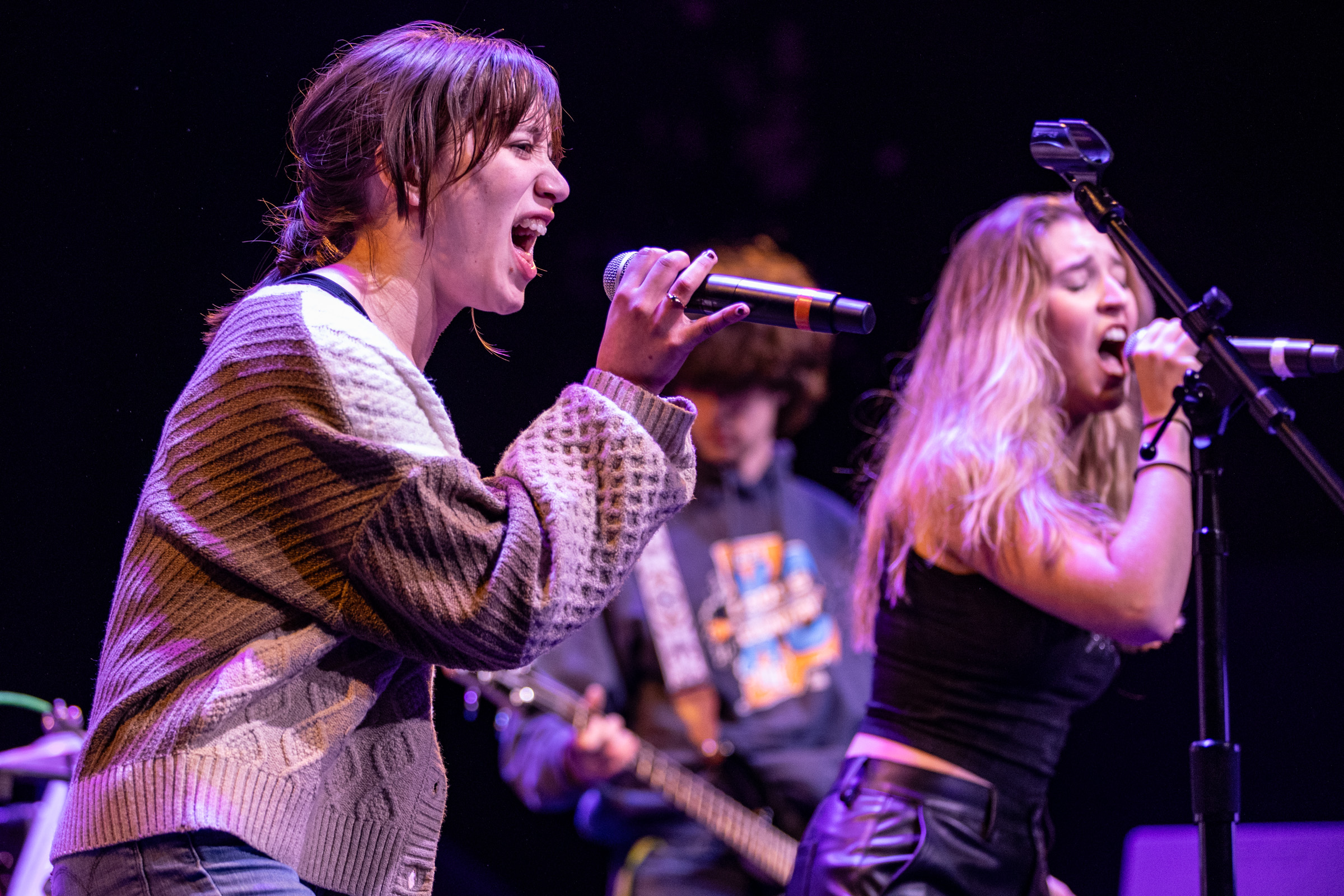 two teens performing onstage