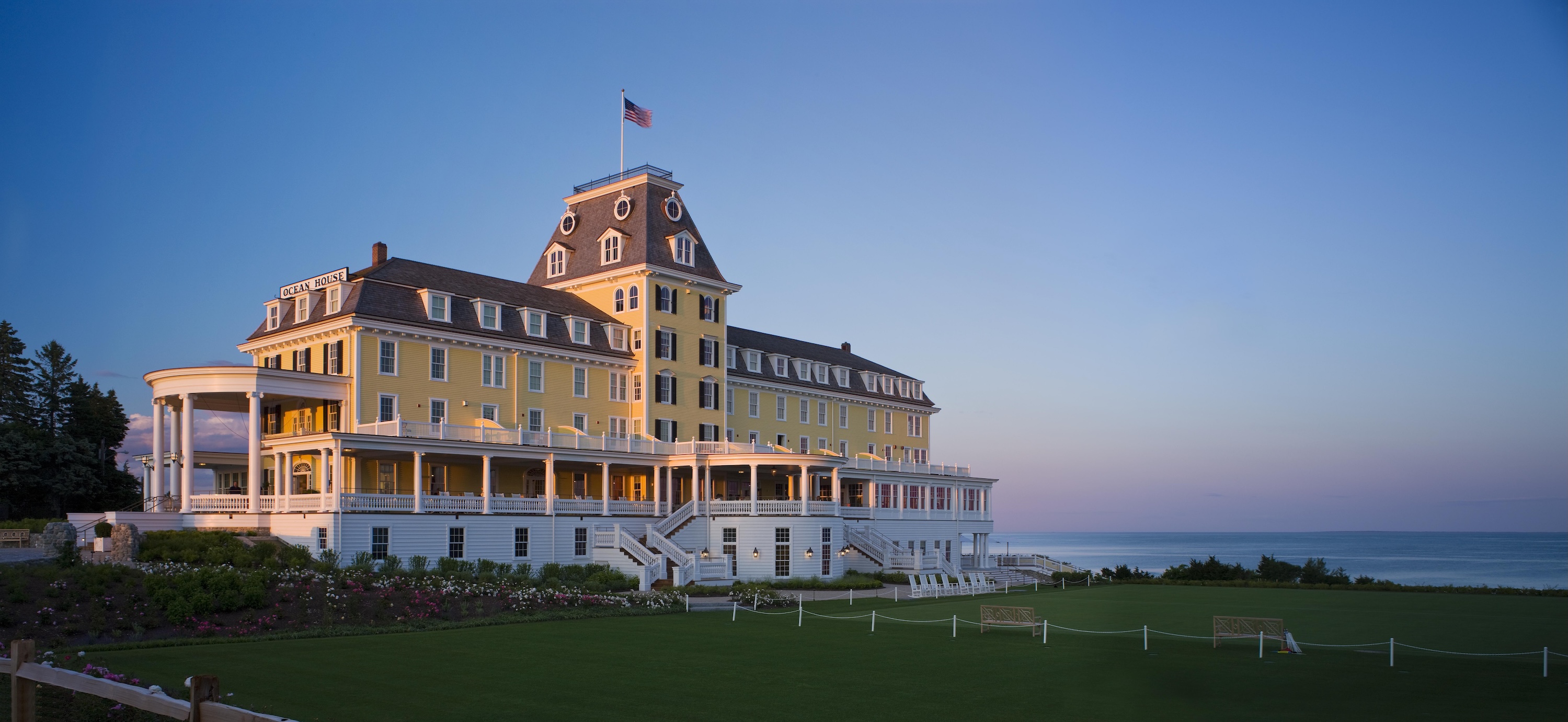 a yellow hotel on the shore