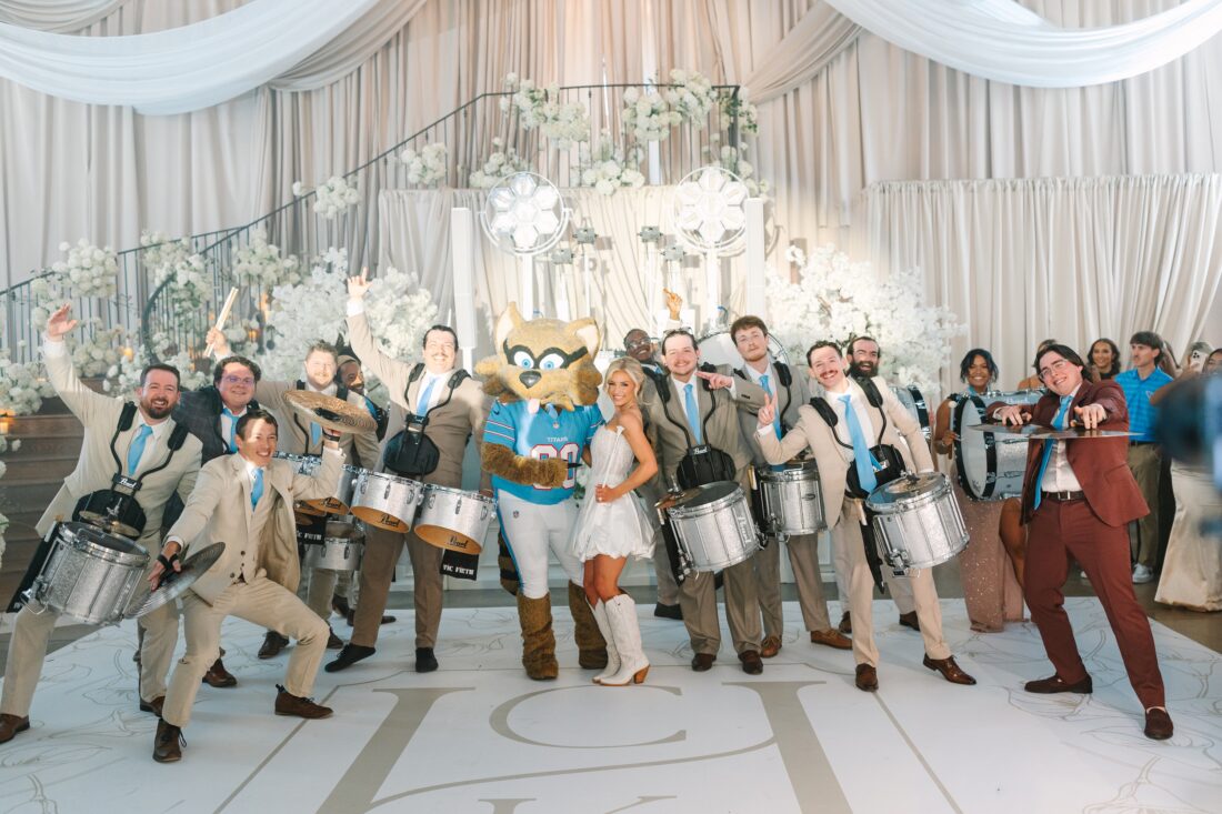 wedding photo with bride and groom with party