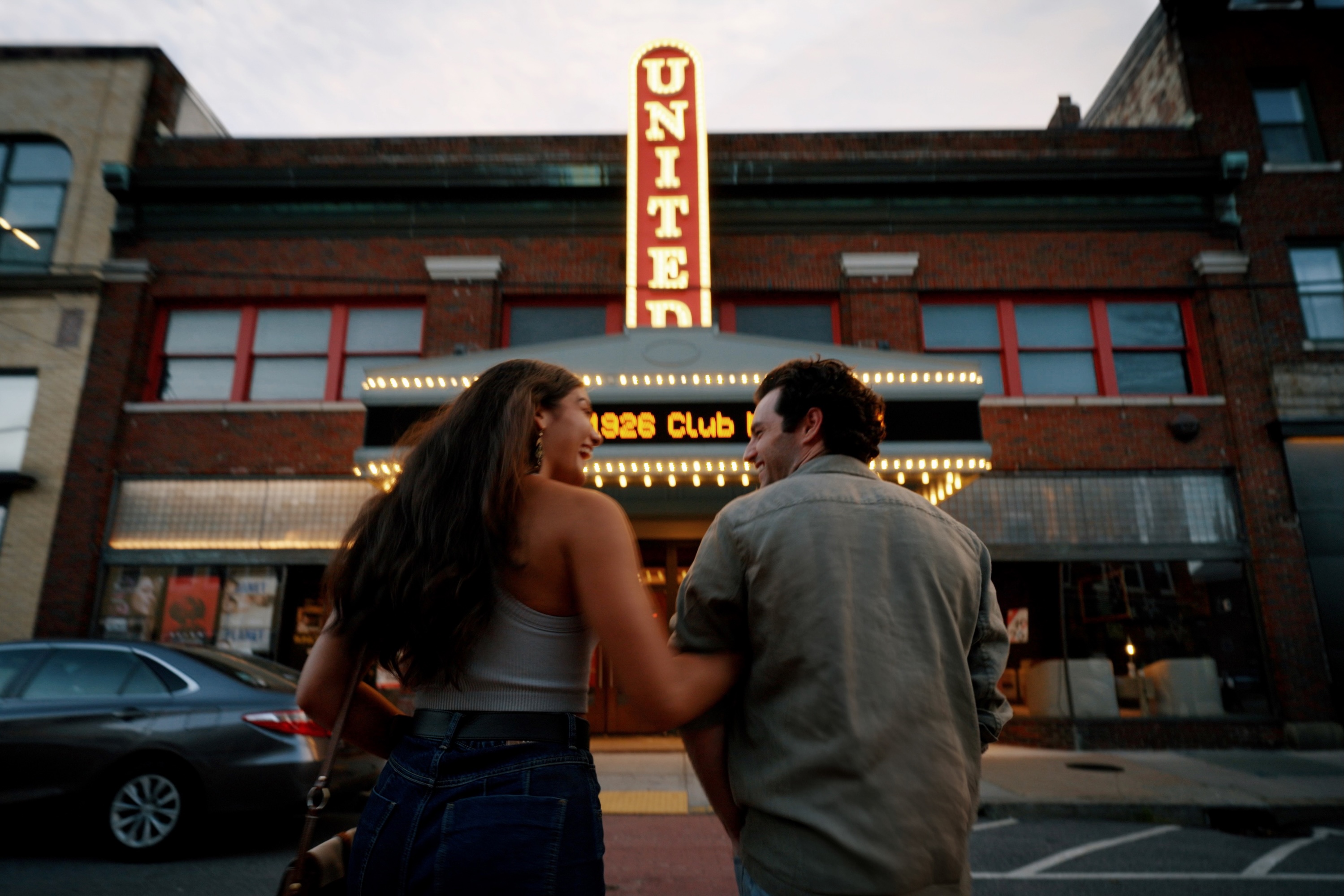 a couple walk into a theatre