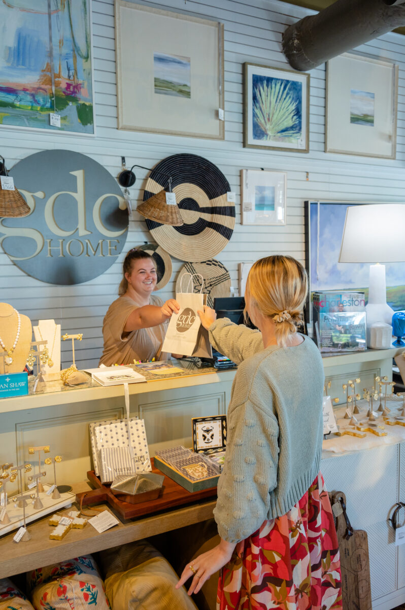 A woman buys something at a home goods store