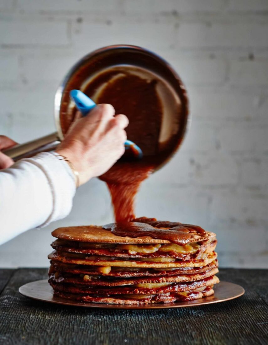 stack of cake with icing poured
