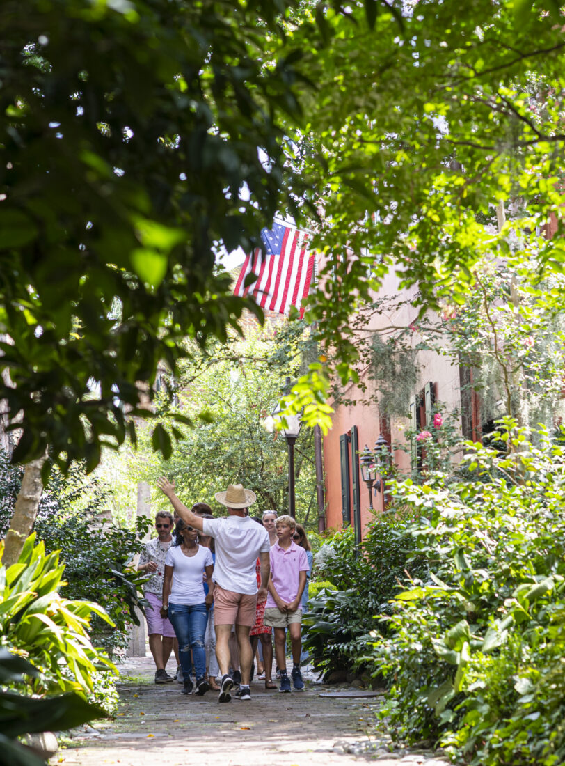 People walk through an alley