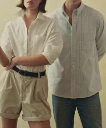 A man and woman in Oxford shirts