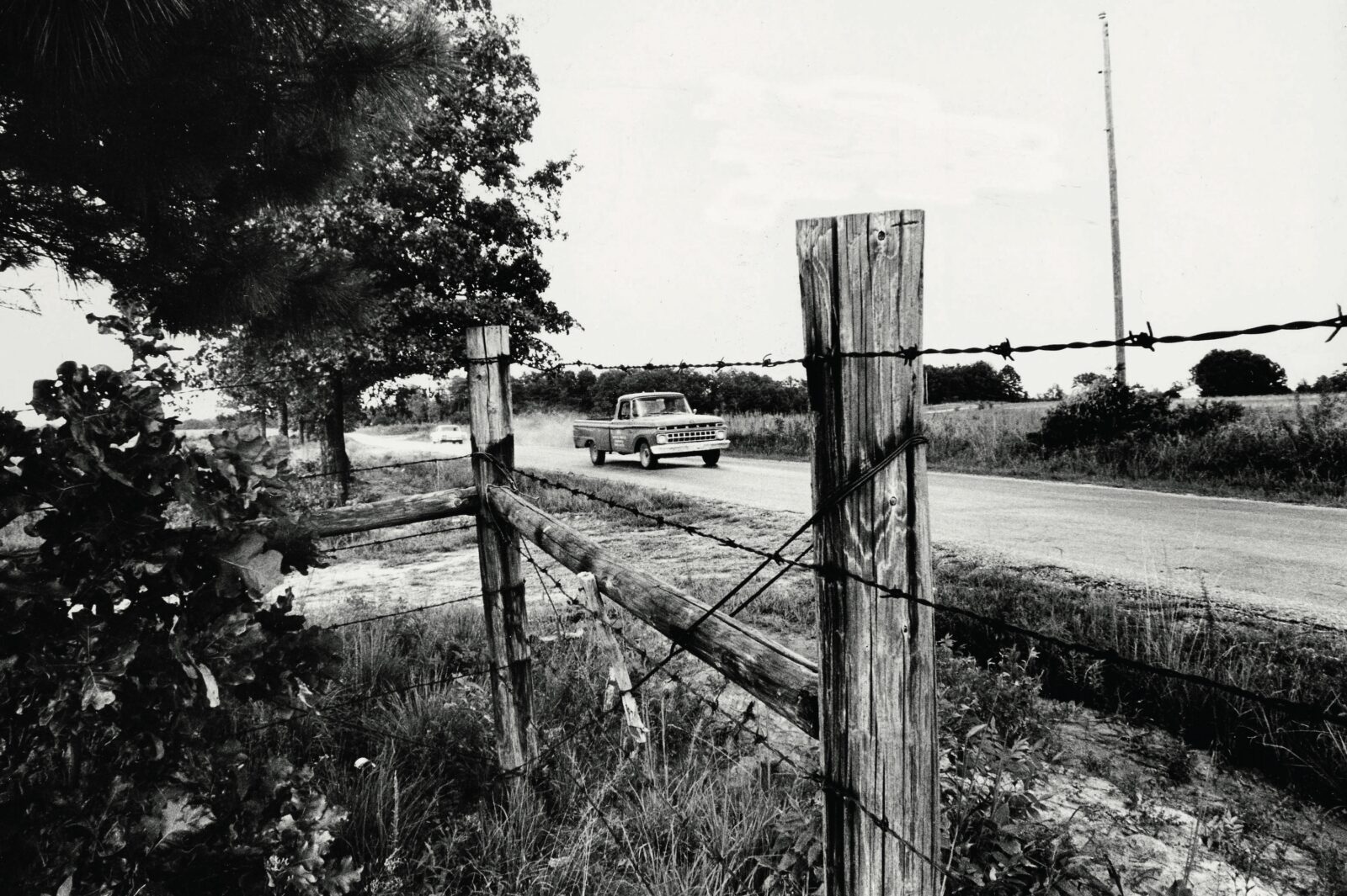 A black and white photo of a road