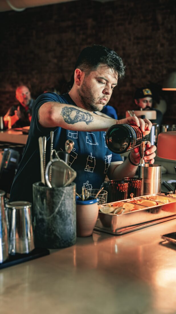 A man pours a drink