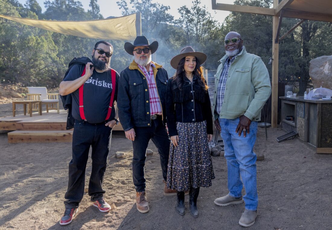 Four people stand outside