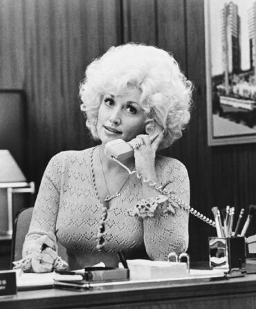 Dolly Parton with a phone