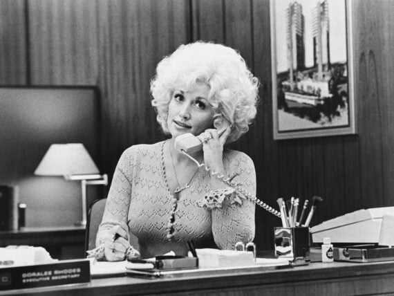 Dolly Parton with a phone
