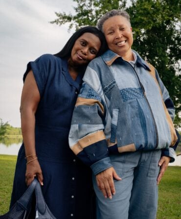 A portrait of two women; one wears a patchwork quilted jacket